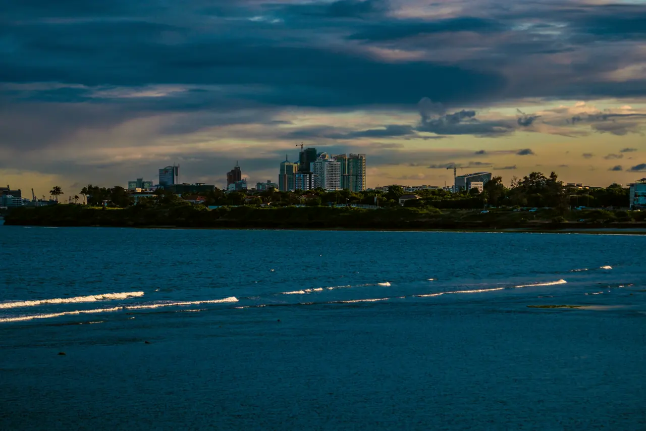 The Dar es Salaam skyline across the water at dusk