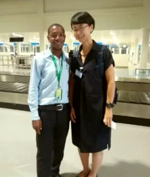 A guest being met at the airport arrivals hall